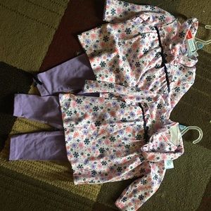 Matching twin girl outfits.